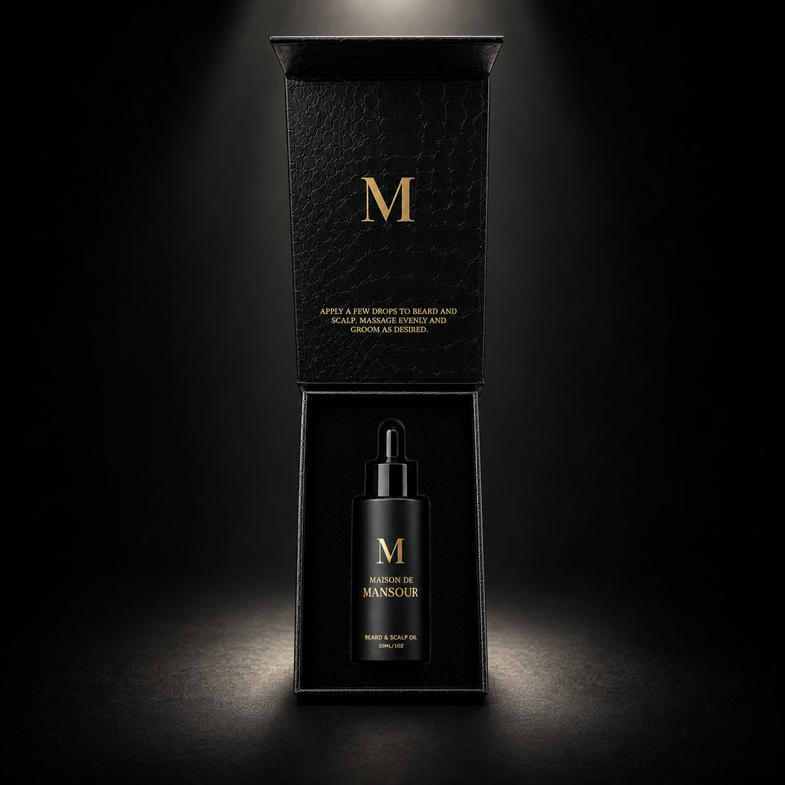Open Maison de Mansour gift box with the bottle inside and the gold M on the lid