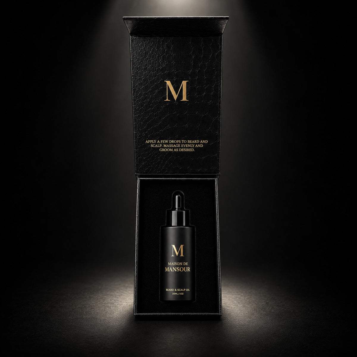 Open Maison de Mansour gift box with the bottle inside and the gold M on the lid